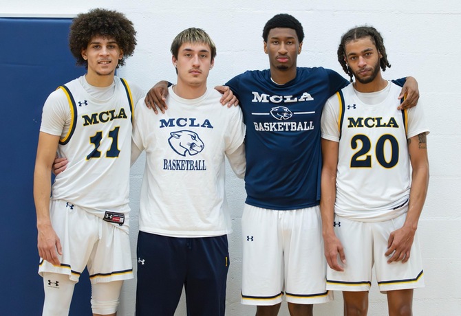 MCLA's senior class of Quentin Gittens, Dylan Morris-Gray, Mamadou Diallo, and Kumar Lewis celebrate Senior Day against Worcester State.