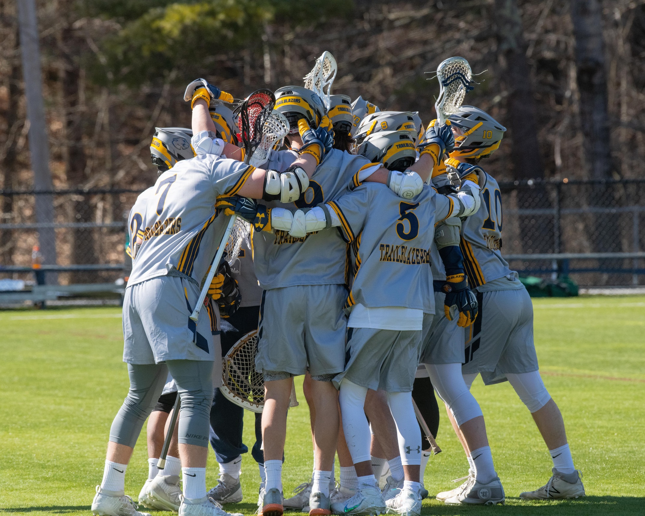The MCLA Men's Lacrosse team celebrates their first win in program history after defeating Lyndon today 6-3